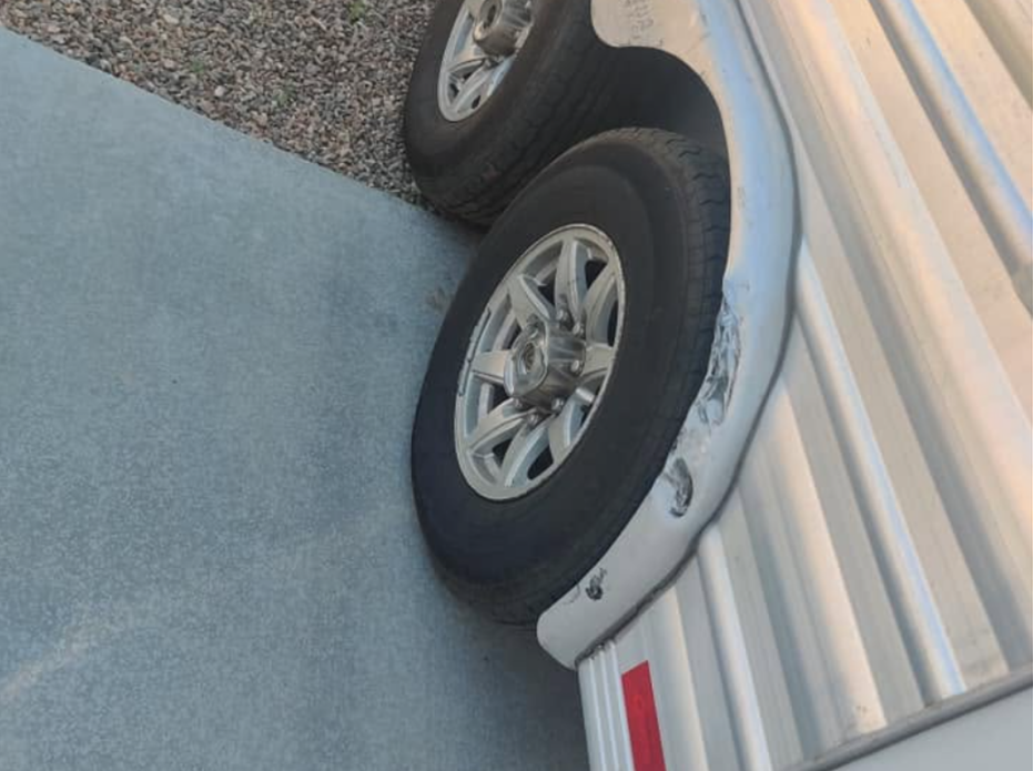 Aluminum horse trailer — fender damage before repair